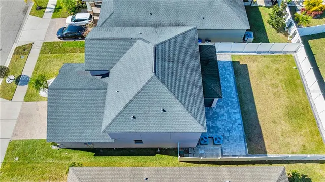 an aerial view of residential houses with outdoor space