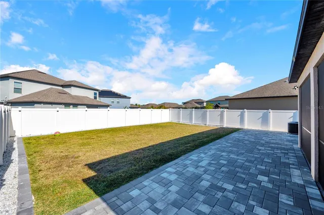 a view of swimming pool with seating area