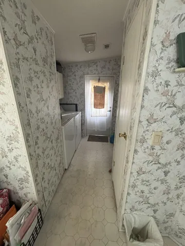 a hallway with couches and a stove top oven