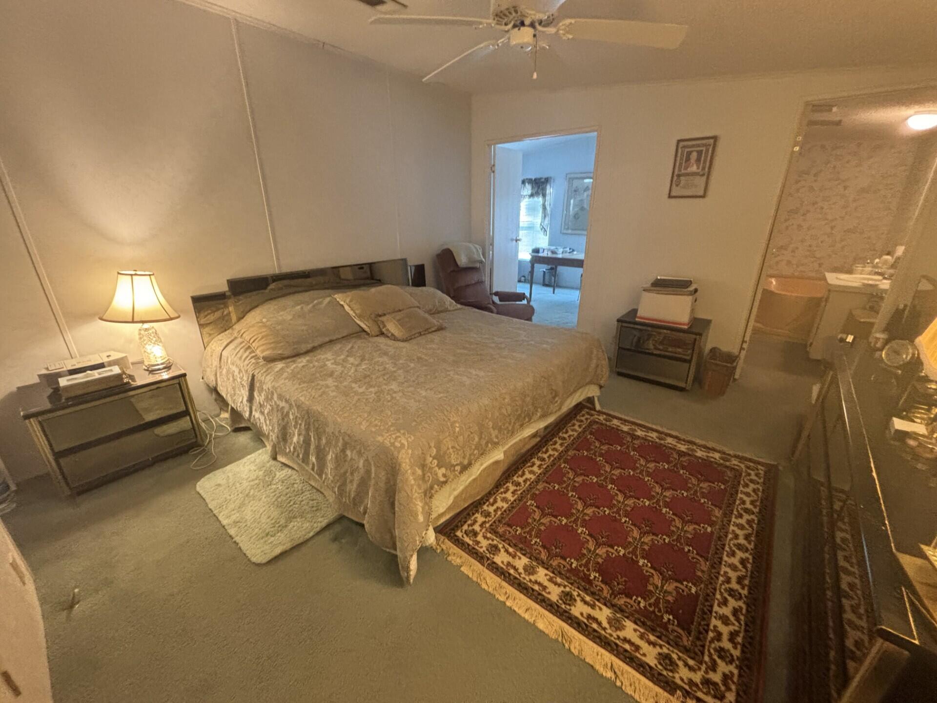 13281 Southwest 10th Manor Davie, FL 33325 - Photo 24 of 43 a bedroom with a bed and wooden floor