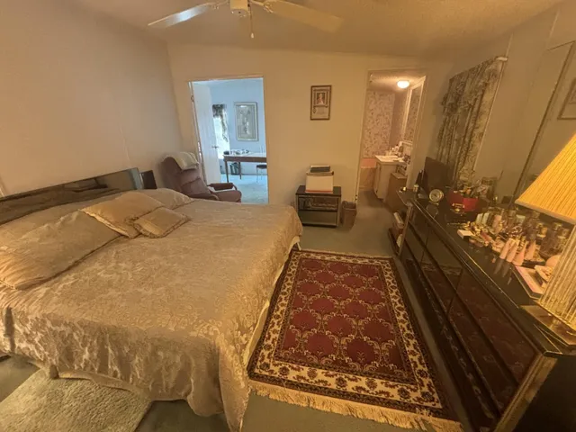 a bed room with a bed window and a dresser