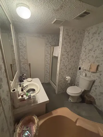 a bedroom with bed and a window