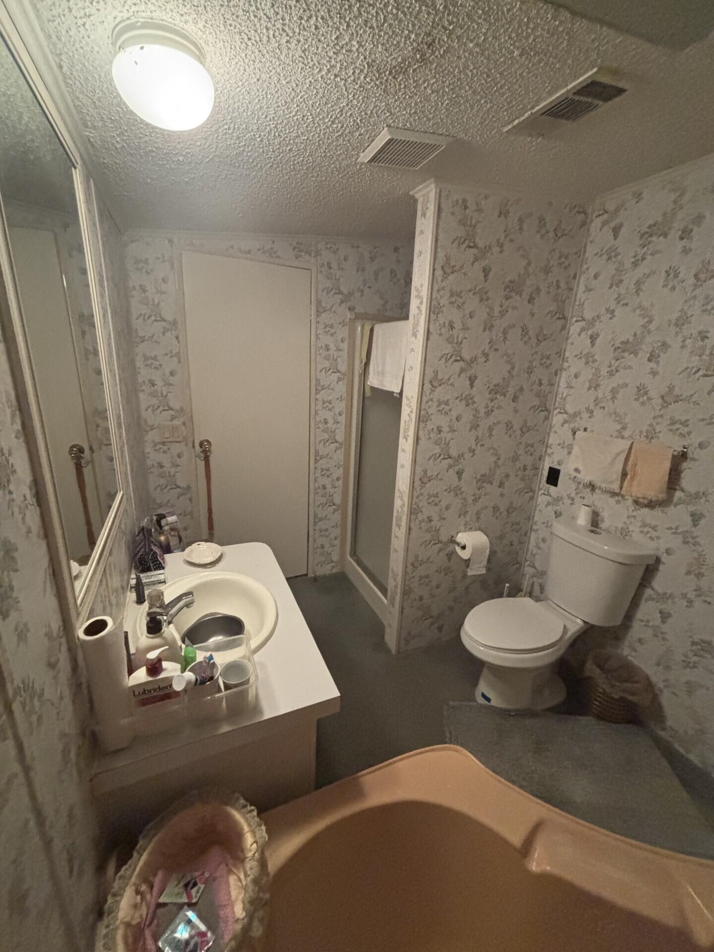 13281 Southwest 10th Manor Davie, FL 33325 - Photo 29 of 43 a bathroom with a toilet sink and shower curtain