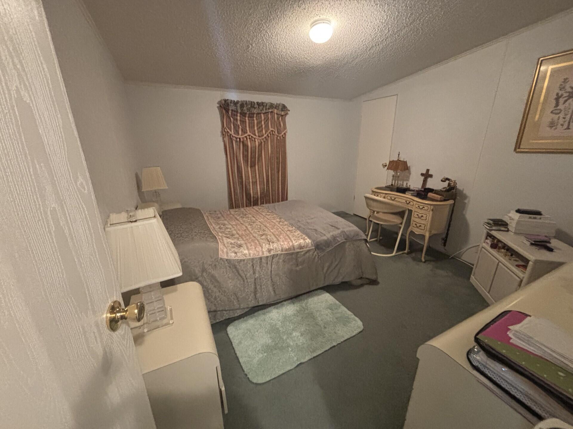 13281 Southwest 10th Manor Davie, FL 33325 - Photo 31 of 43 a bedroom with bed and a window