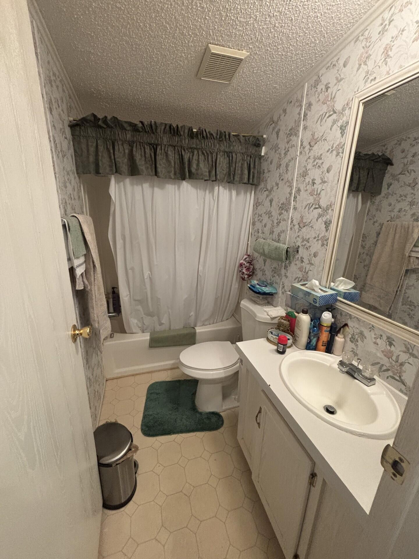 13281 Southwest 10th Manor Davie, FL 33325 - Photo 33 of 43 a bathroom with a bathtub sink mirror vanity and toilet