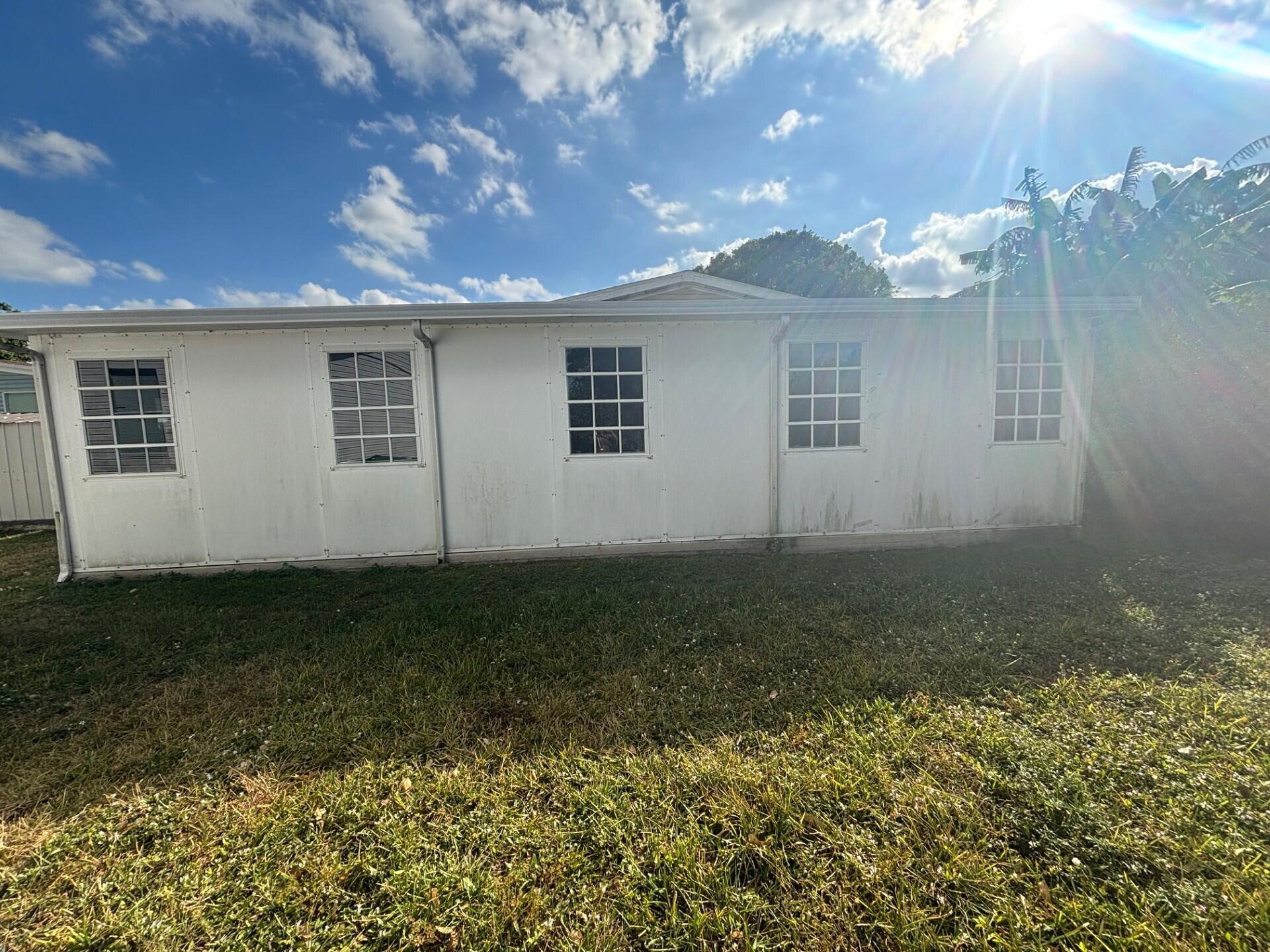 13281 Southwest 10th Manor Davie, FL 33325 - Photo 40 of 43 a view of a house with a yard