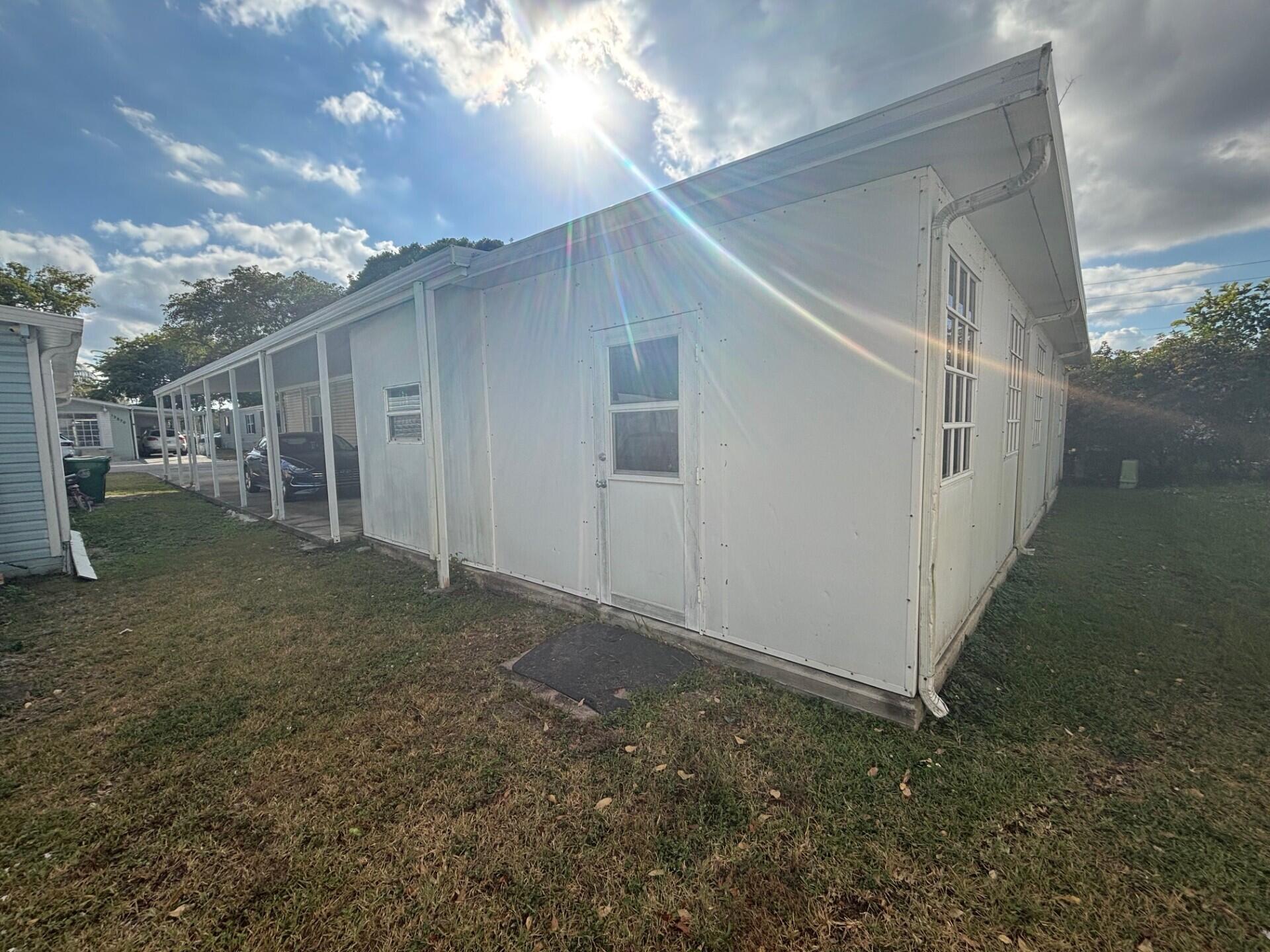 13281 Southwest 10th Manor Davie, FL 33325 - Photo 41 of 43 a view of a house with a yard