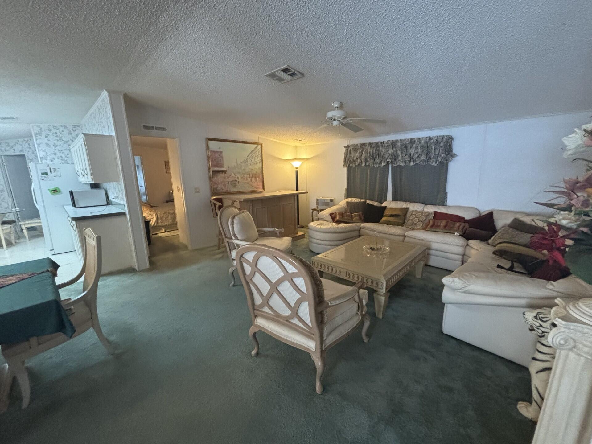 13281 Southwest 10th Manor Davie, FL 33325 - Photo 8 of 43 a living room with furniture and a fireplace