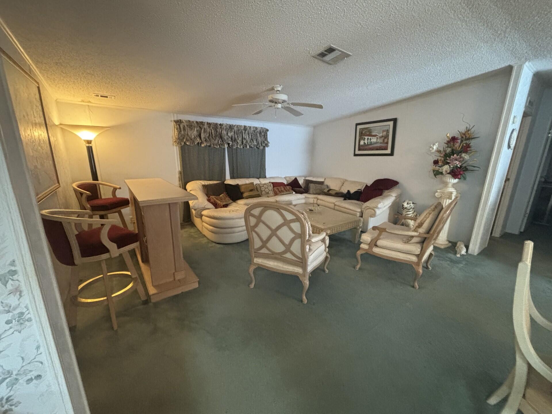 13281 Southwest 10th Manor Davie, FL 33325 - Photo 9 of 43 a living room with furniture and a window