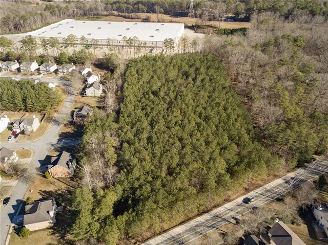 a view of a yard with trees