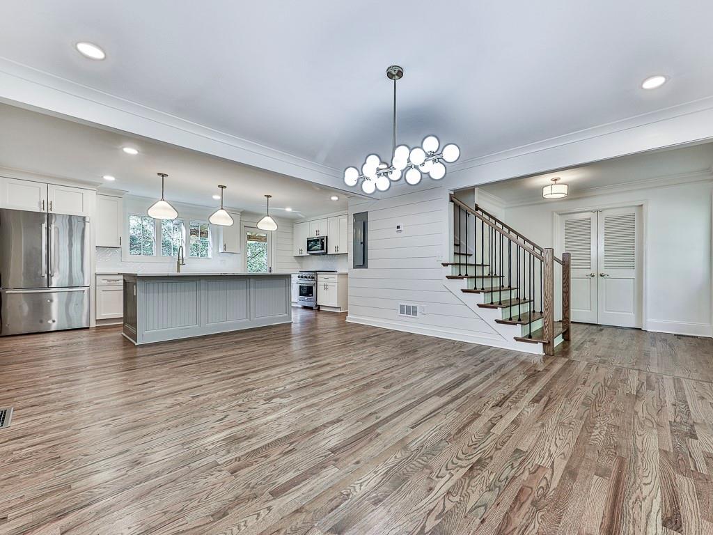 633 Butterworth Road Canton, GA 30114 - Photo 7 of 55 a view of a room with chandelier and wooden floor