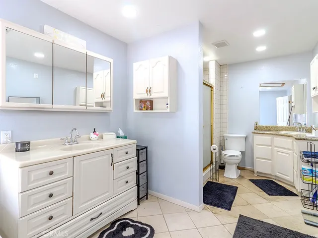 a room with a white cabinets and washer dryer