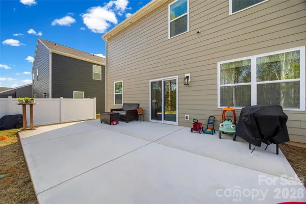 a view of a house with sitting area and a yard