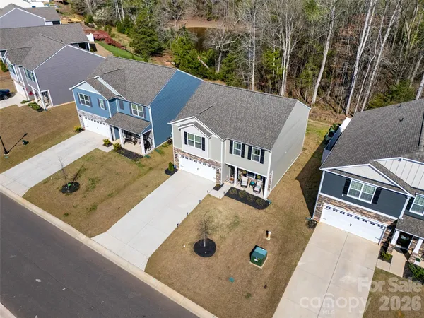 an aerial view of residential house with outdoor space and parking