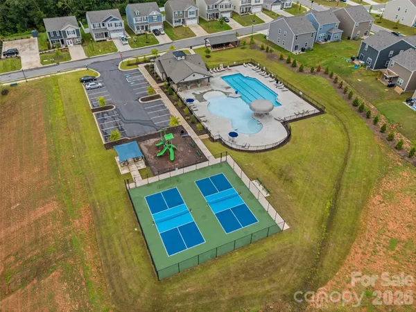 an aerial view of residential house with pool
