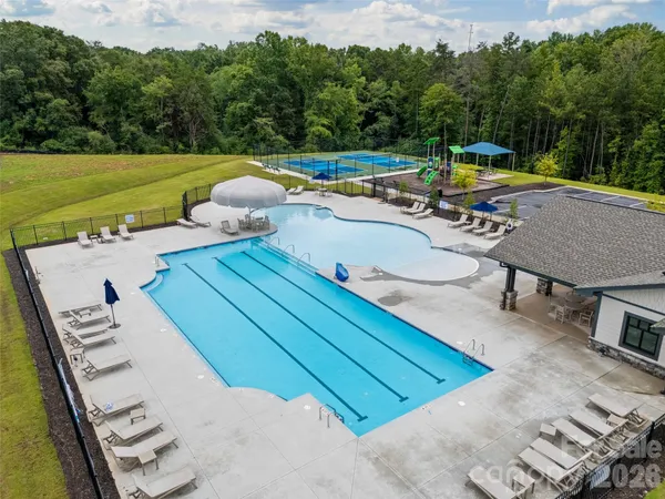 a view of a swimming pool with a lounge chairs