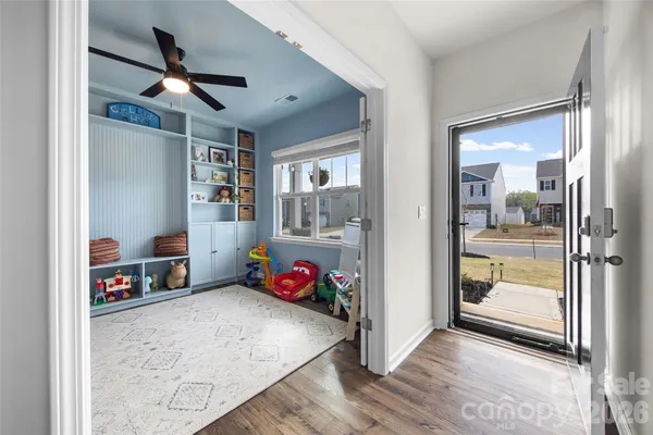 a view of livingroom with hardwood floor and a ceiling fan