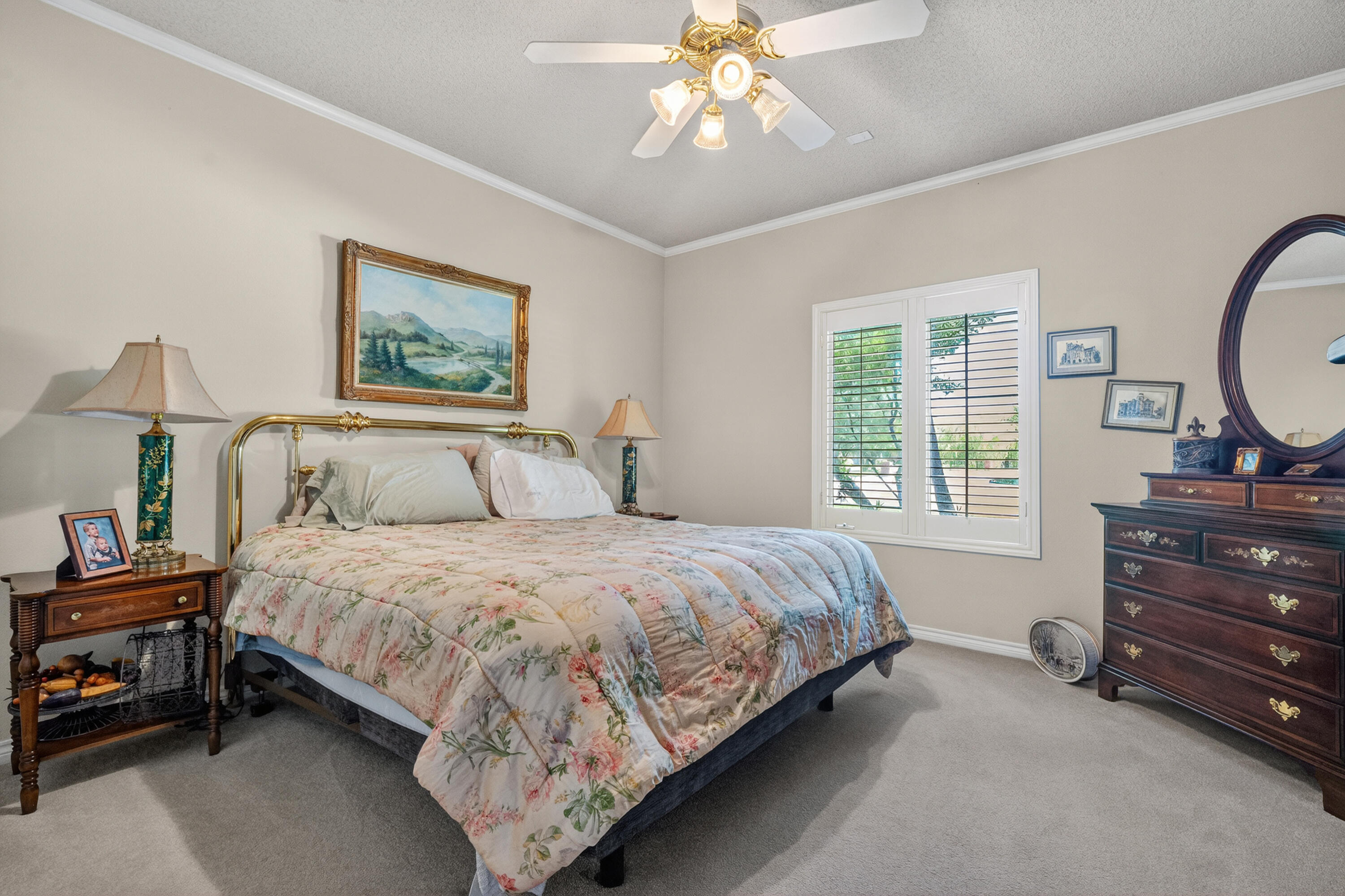 7402 95th Street Lubbock, TX 79424 - Photo 30 of 43 a bedroom with a bed and a dresser