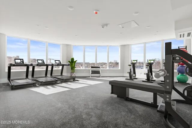 a living room with lots of furniture and white walls