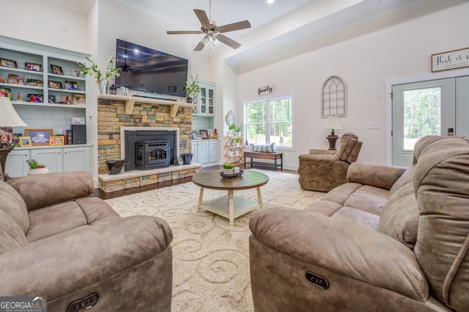 3060 Eatonton Road Madison, GA 30650 - Photo 4 of 65 a living room with furniture a fireplace and a flat screen tv
