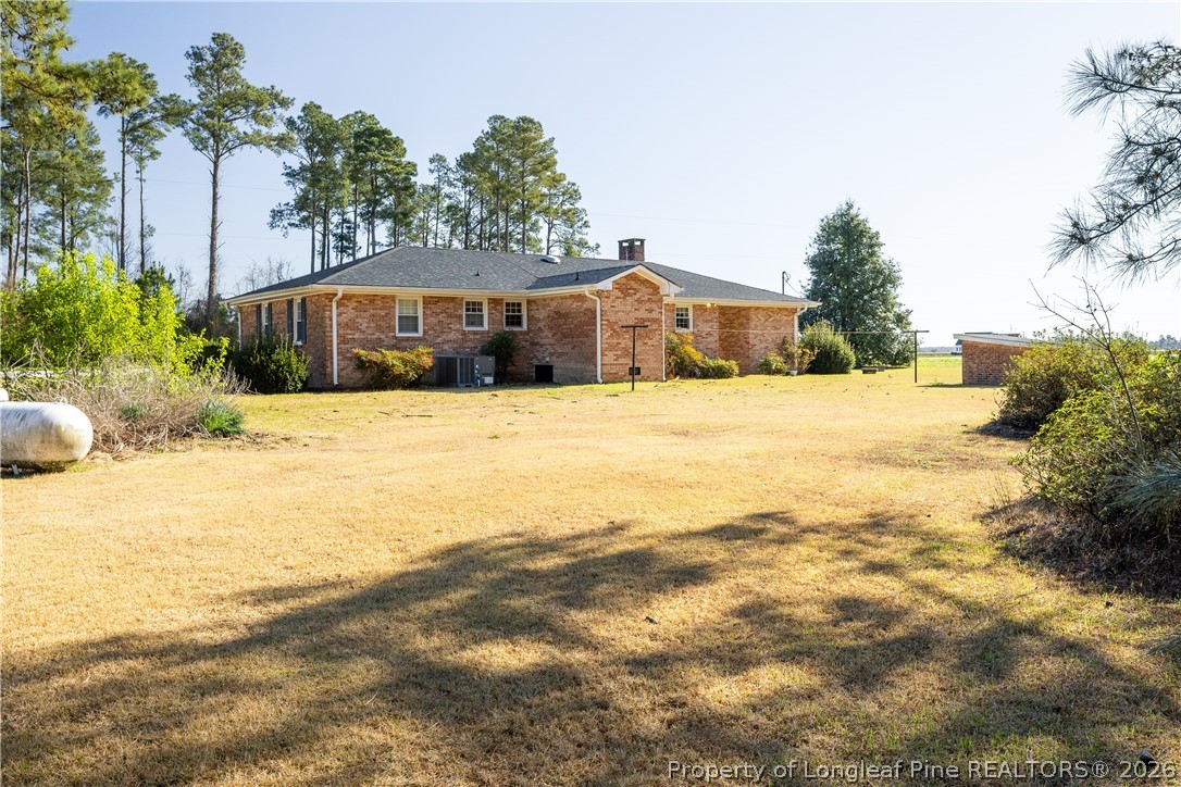 5424 Bonnetsville Road Clinton, NC 28328 - Photo 28 of 29 a front view of a house with a yard and garage