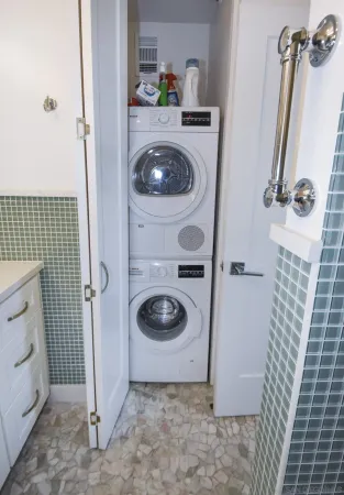 a bathroom with a sink and a washing machine