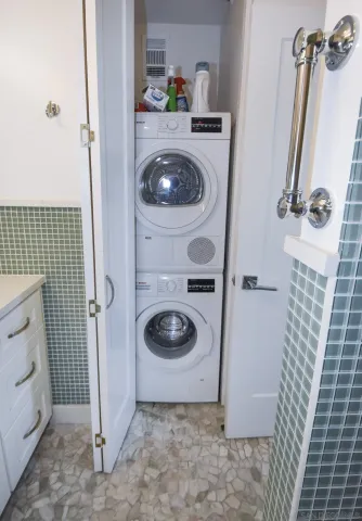 a bathroom with a sink and a washing machine