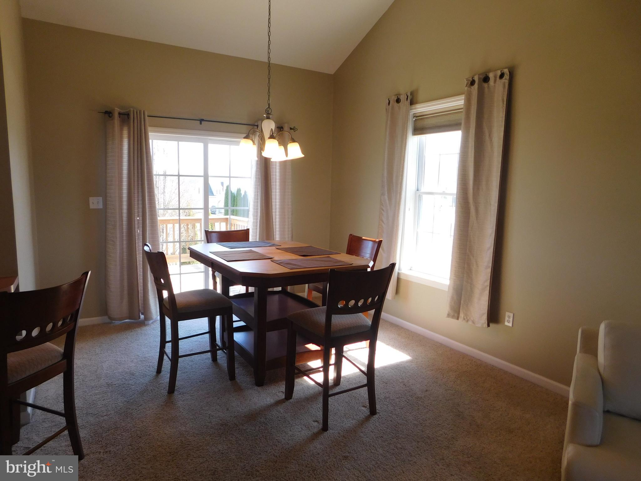 5405 Board Road Mount Wolf, PA 17347 - Photo 4 of 28 Bright dining area with doors leading to deck