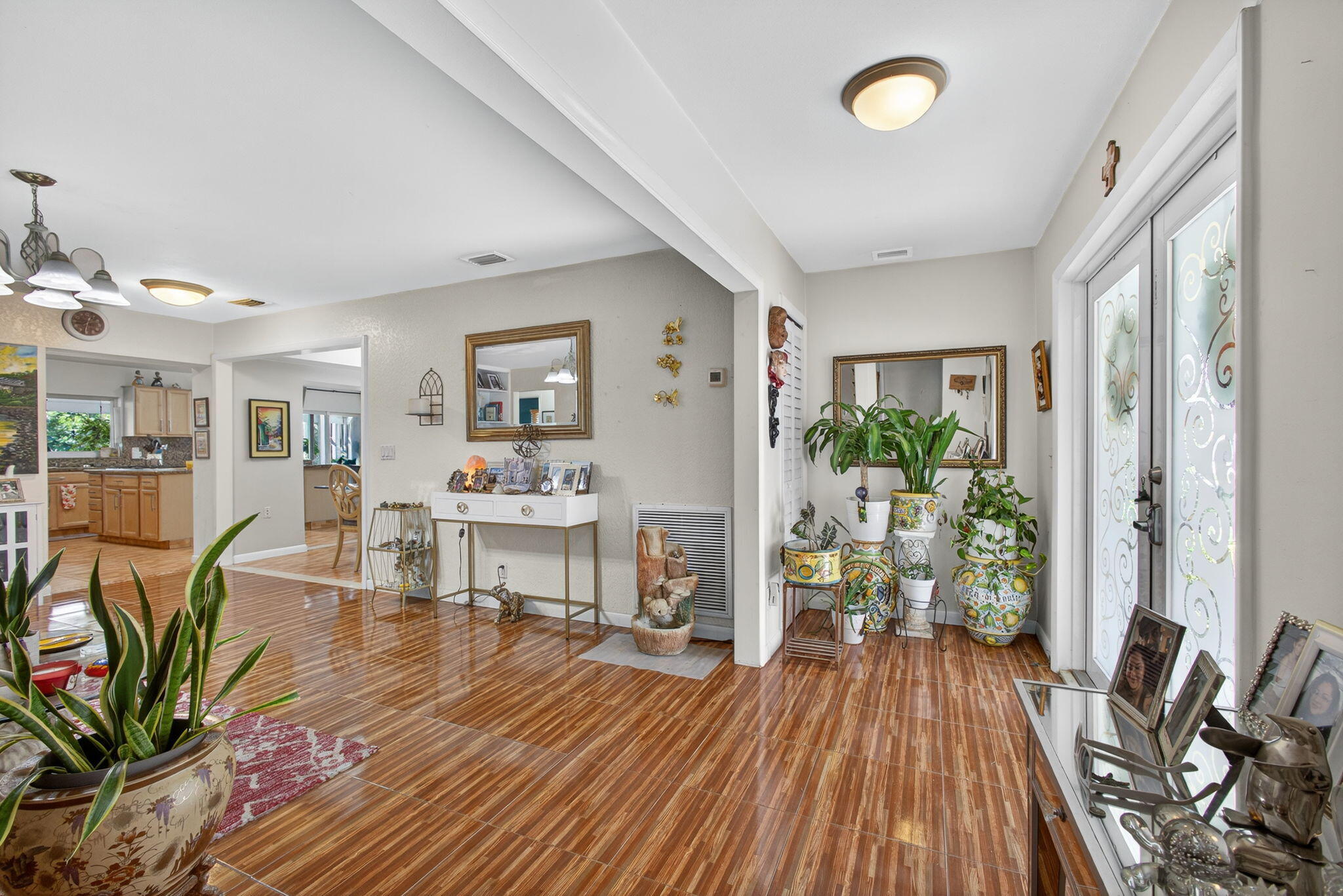 7625 Clarke Road Lake Clarke Shores, FL 33406 - Photo 11 of 97 a living room with furniture a wooden floor and a chandelier