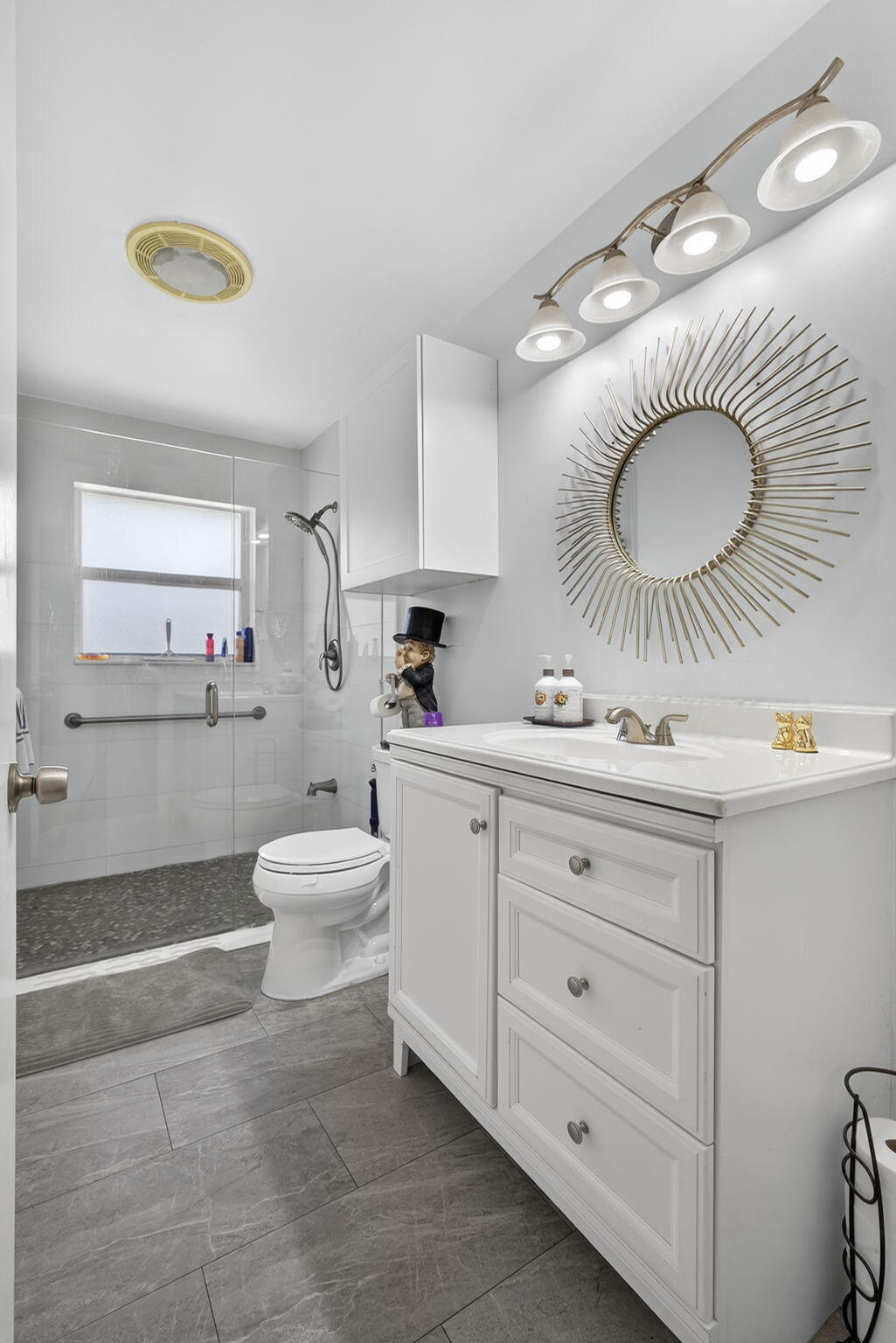 7625 Clarke Road Lake Clarke Shores, FL 33406 - Photo 20 of 97 a bathroom with a granite countertop sink mirror and toilet
