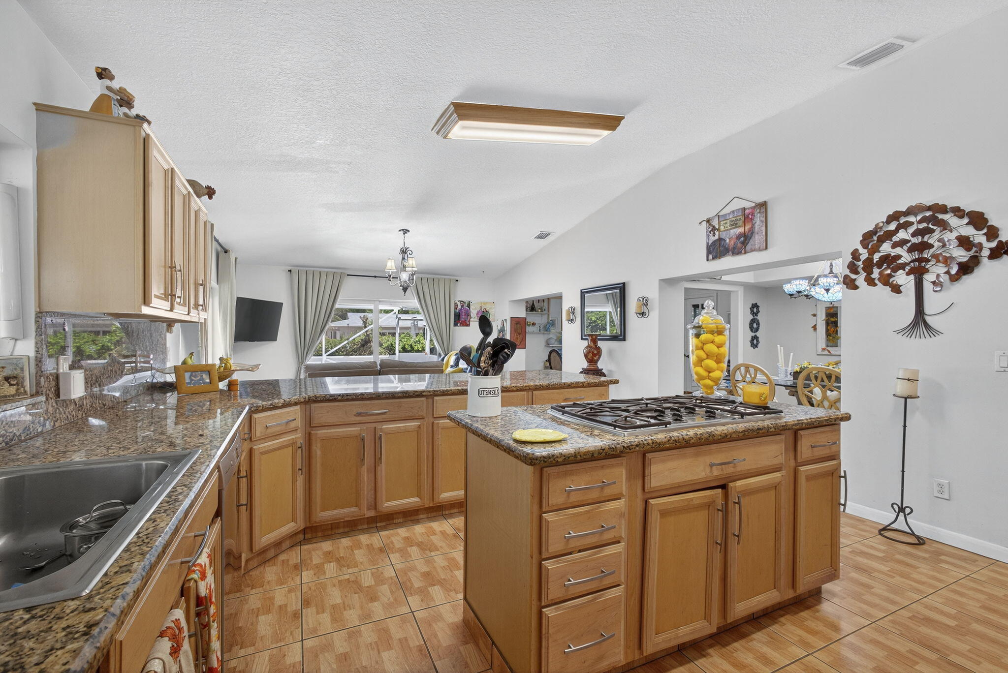 7625 Clarke Road Lake Clarke Shores, FL 33406 - Photo 29 of 97 a kitchen with stainless steel appliances granite countertop a sink and cabinets