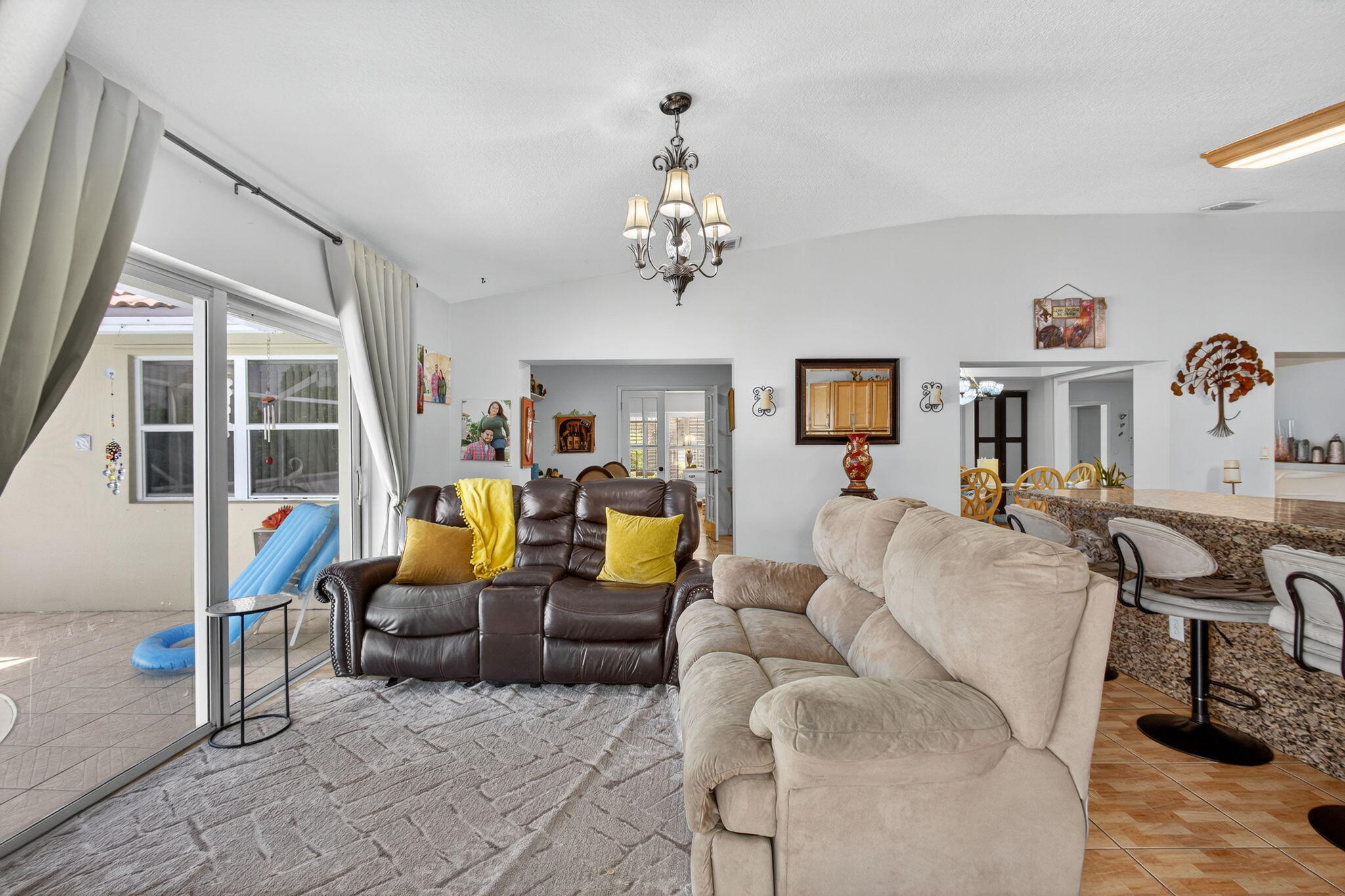 7625 Clarke Road Lake Clarke Shores, FL 33406 - Photo 40 of 97 a living room with furniture a flat screen tv and a large window