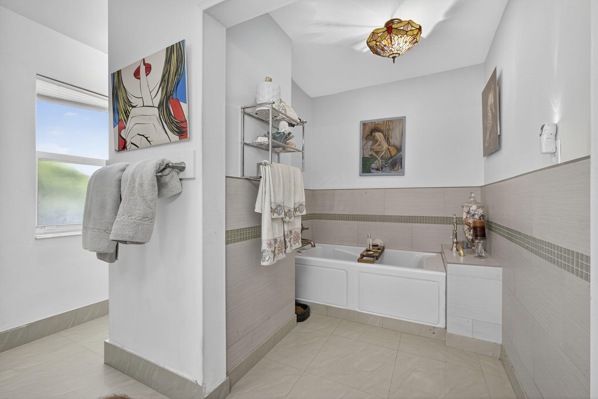 7625 Clarke Road Lake Clarke Shores, FL 33406 - Photo 52 of 97 a bathroom with a bathtub and a shower