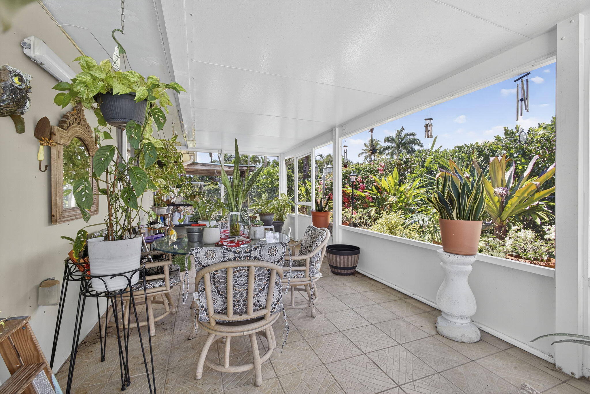7625 Clarke Road Lake Clarke Shores, FL 33406 - Photo 58 of 97 a dining room filled with furniture and a potted plant