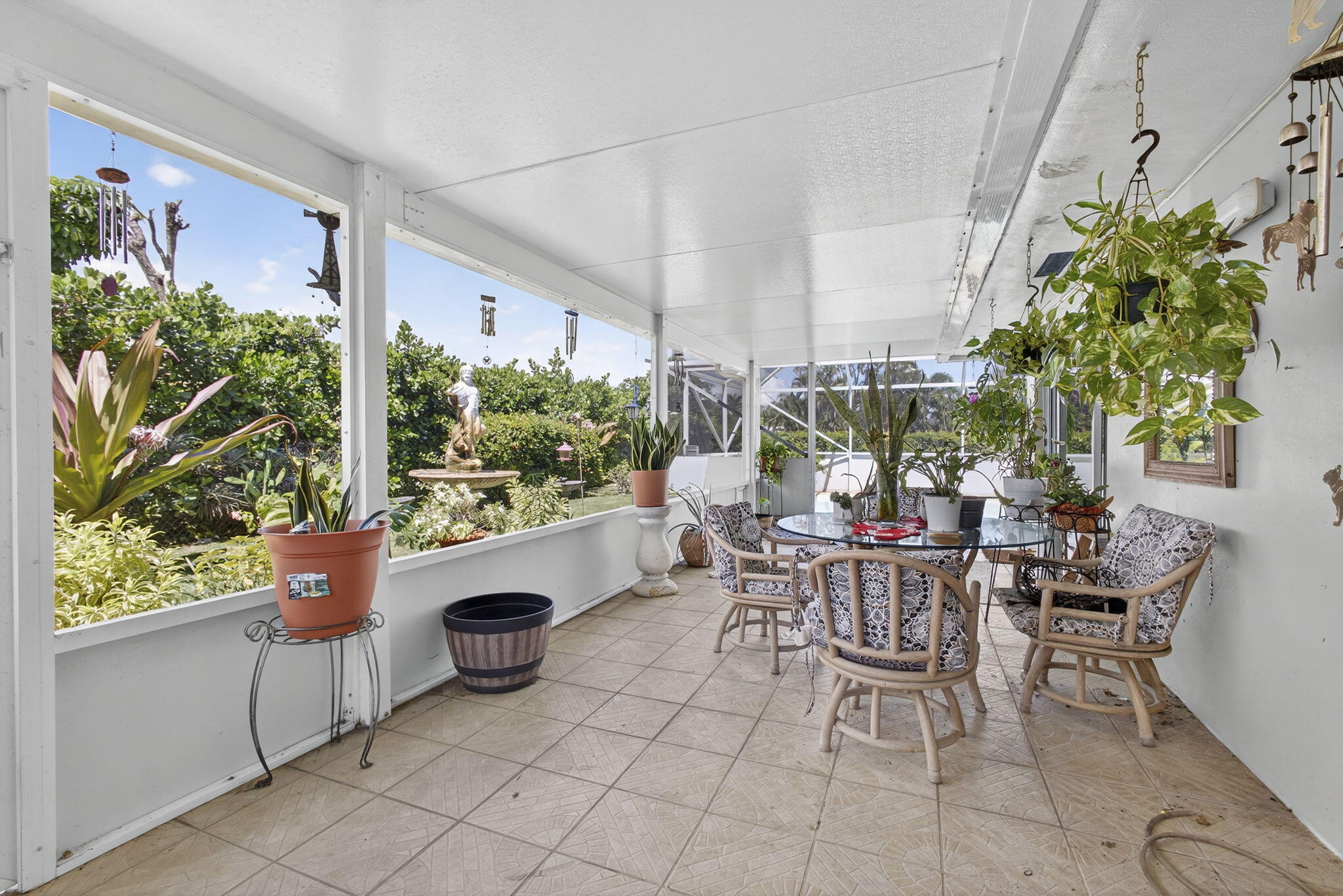 7625 Clarke Road Lake Clarke Shores, FL 33406 - Photo 59 of 97 a view of an outdoor dining space with a table and chairs