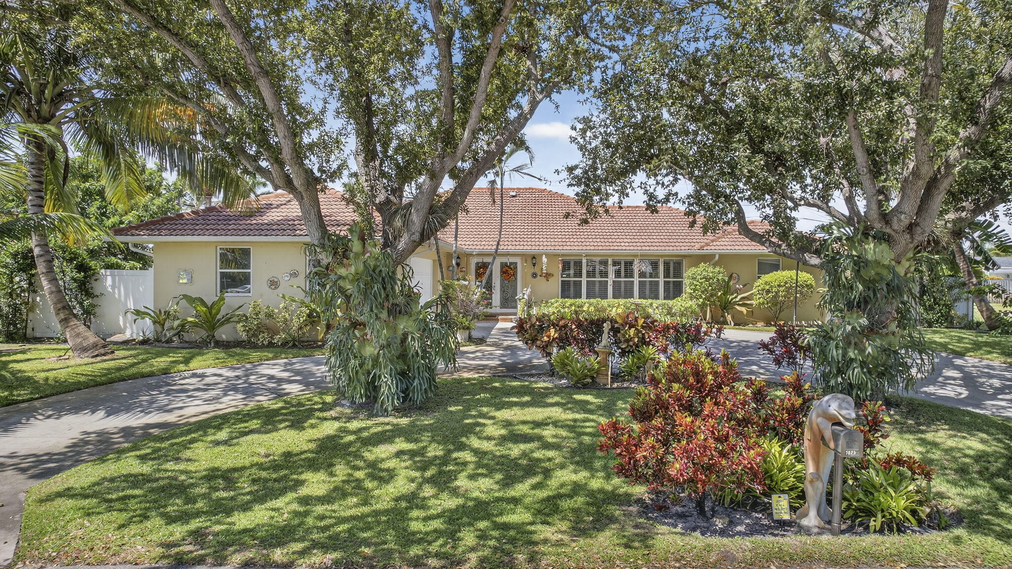 7625 Clarke Road Lake Clarke Shores, FL 33406 - Photo 79 of 97 a front view of a house with garden