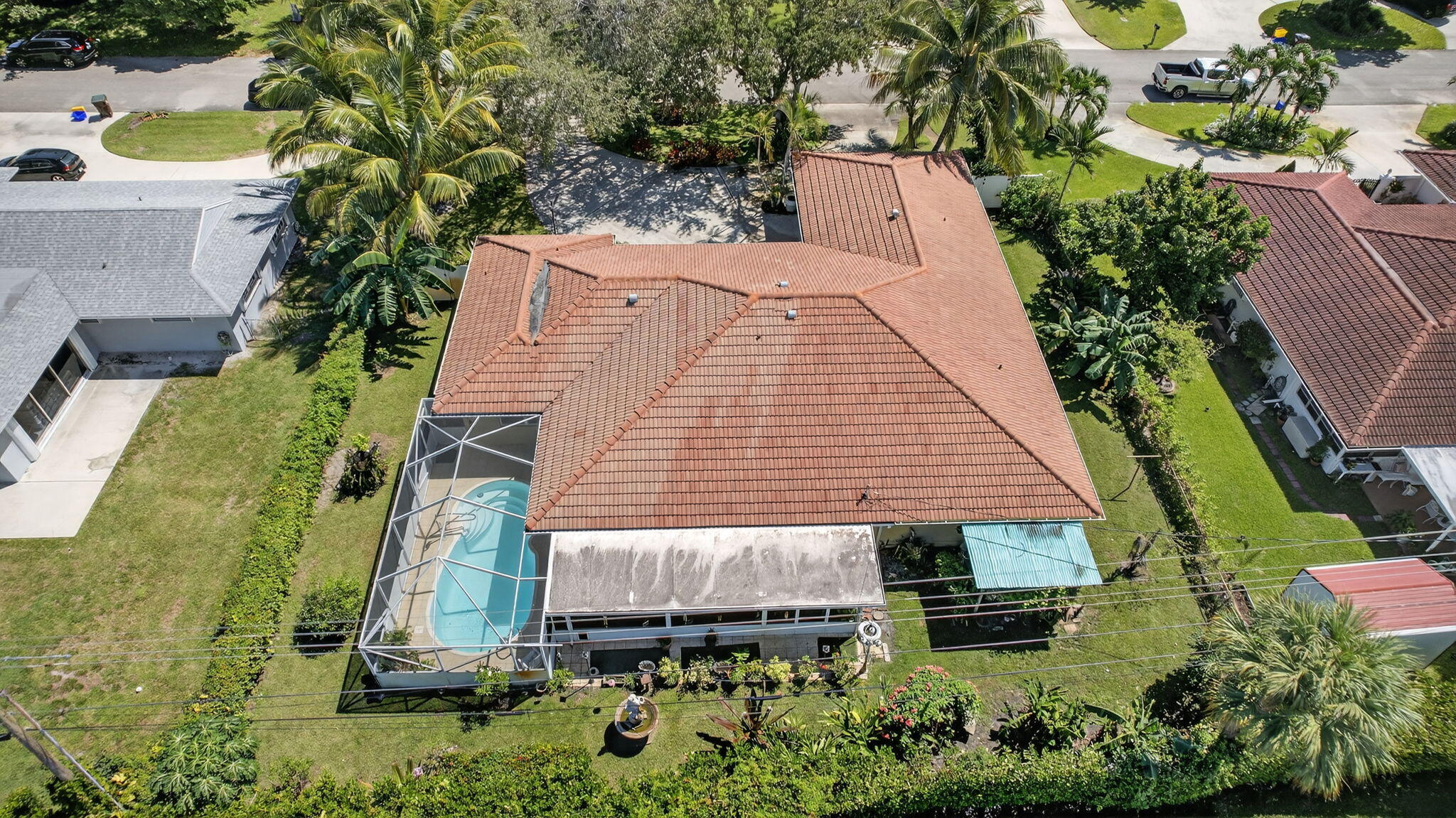 7625 Clarke Road Lake Clarke Shores, FL 33406 - Photo 95 of 97 an aerial view of a house with a yard and potted plants