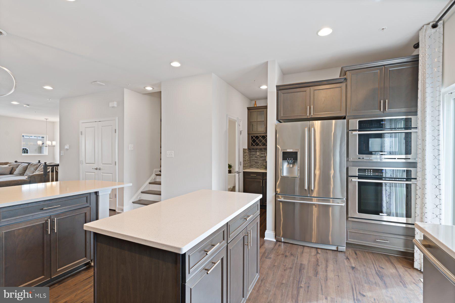2713 Lady Slipper Road Gambrills, MD 21054 - Photo 16 of 55 a kitchen with a refrigerator and a sink