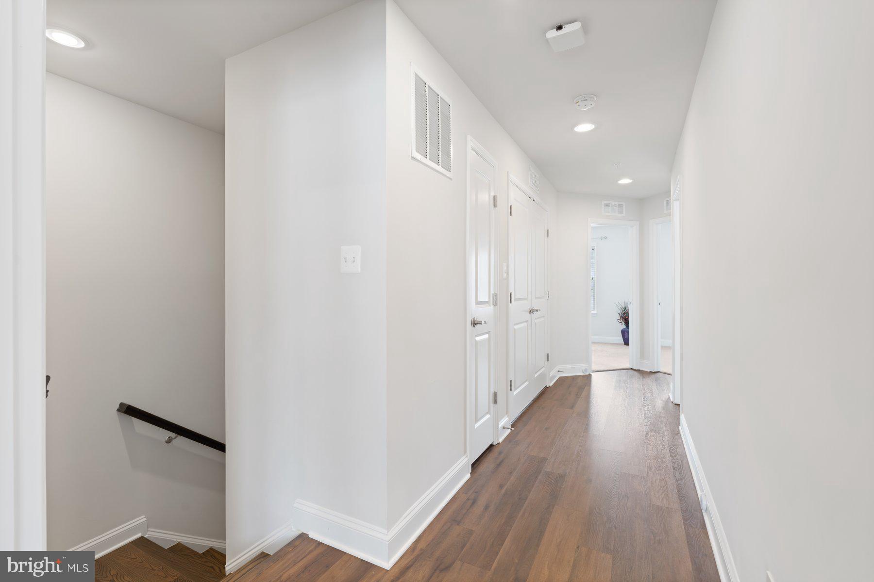 2713 Lady Slipper Road Gambrills, MD 21054 - Photo 22 of 55 a view of a hallway with wooden floor
