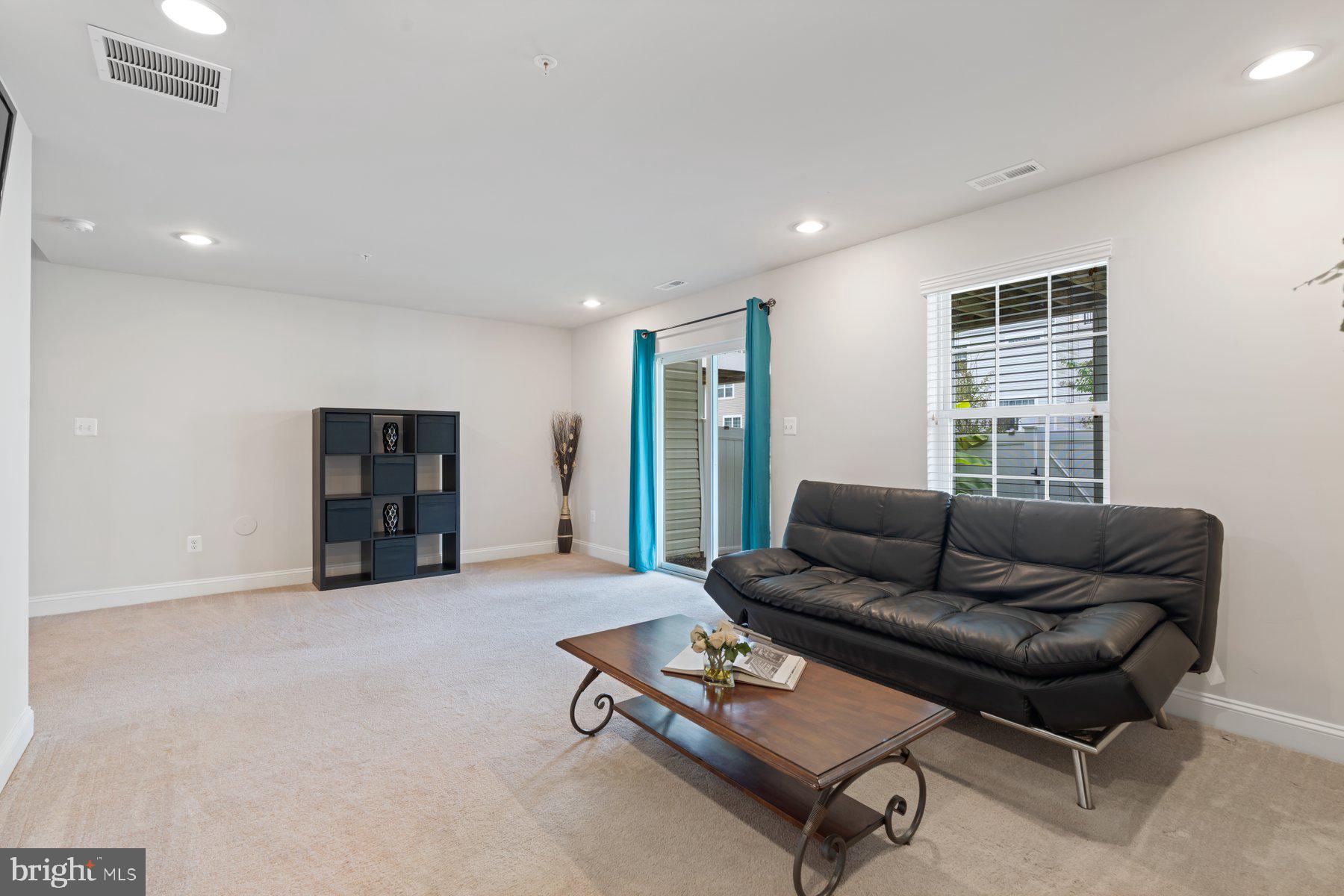 2713 Lady Slipper Road Gambrills, MD 21054 - Photo 34 of 55 a living room with furniture and a window