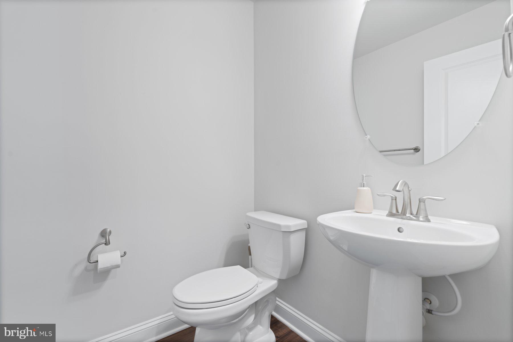 2713 Lady Slipper Road Gambrills, MD 21054 - Photo 36 of 55 a bathroom with a sink toilet and a mirror