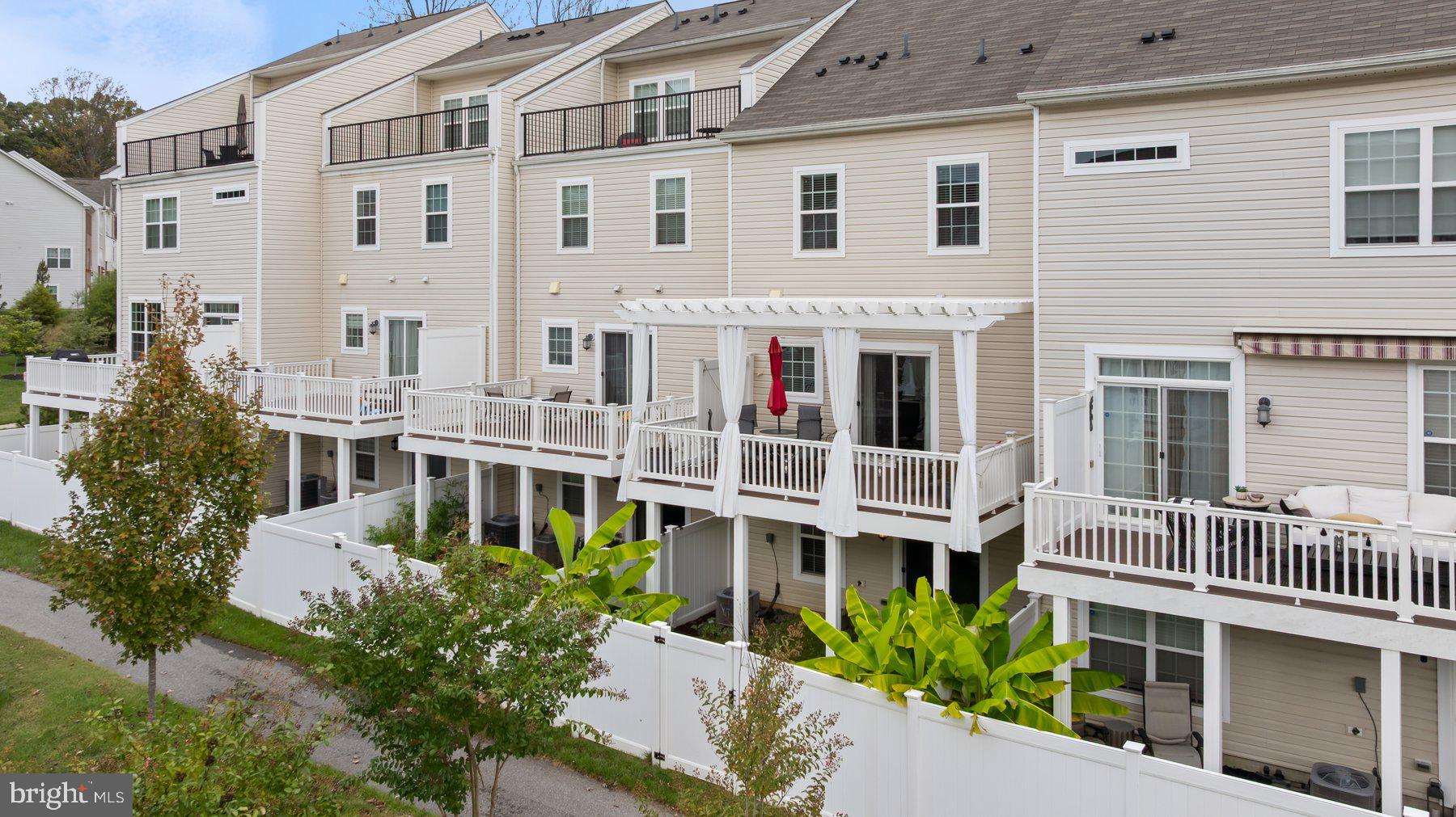 2713 Lady Slipper Road Gambrills, MD 21054 - Photo 40 of 55 a front view of a building with a garden