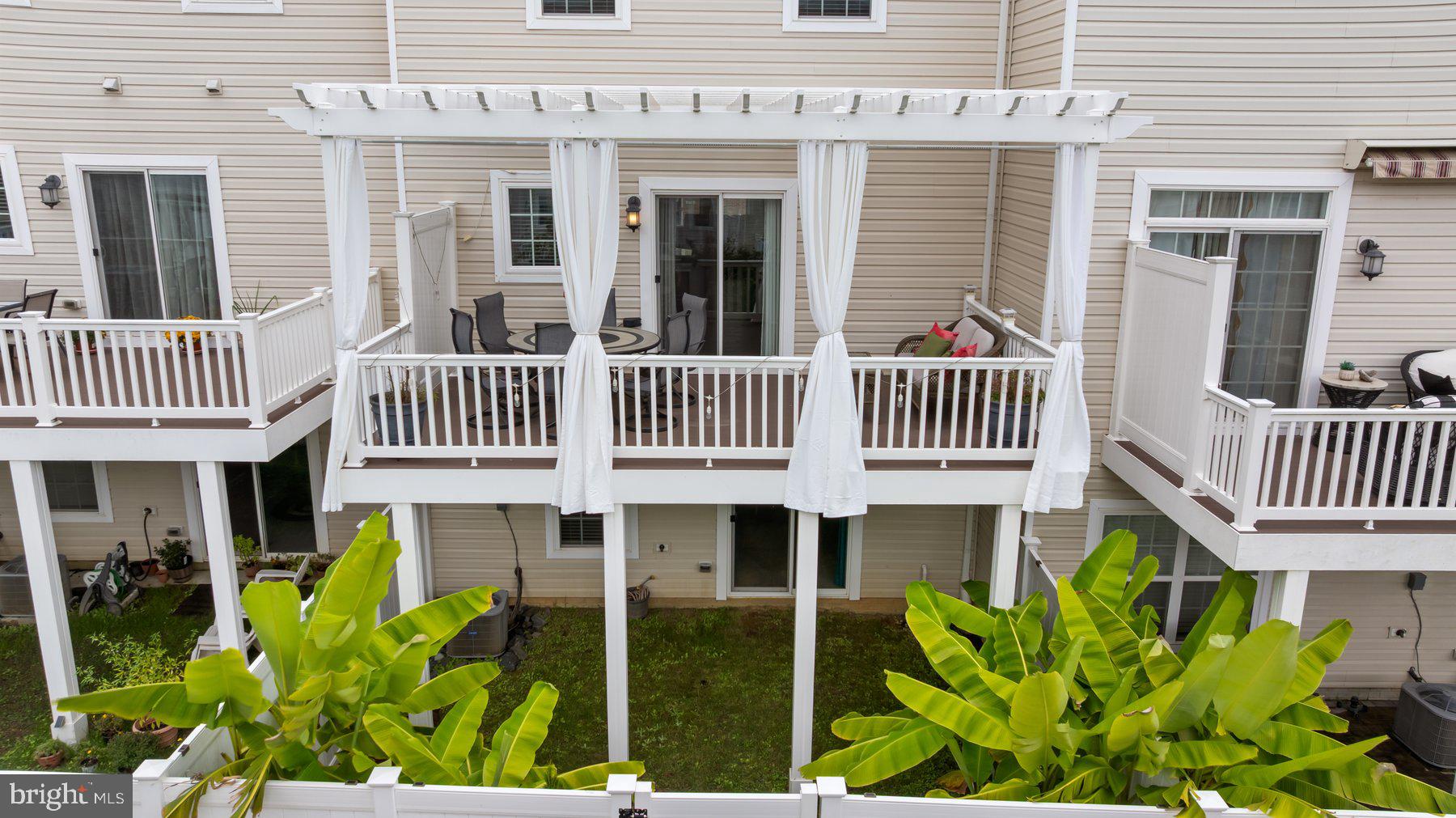 2713 Lady Slipper Road Gambrills, MD 21054 - Photo 41 of 55 a view of a house with a porch and a garden