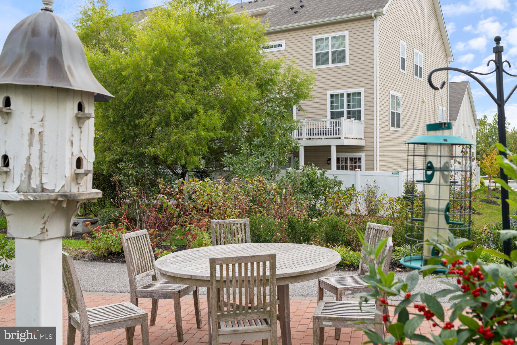 2713 Lady Slipper Road Gambrills, MD 21054 - Photo 45 of 55 a view of a patio with table and chairs and potted plants