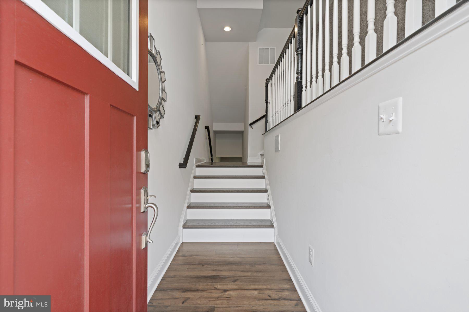 2713 Lady Slipper Road Gambrills, MD 21054 - Photo 8 of 55 a view of staircase with wooden floor and white walls