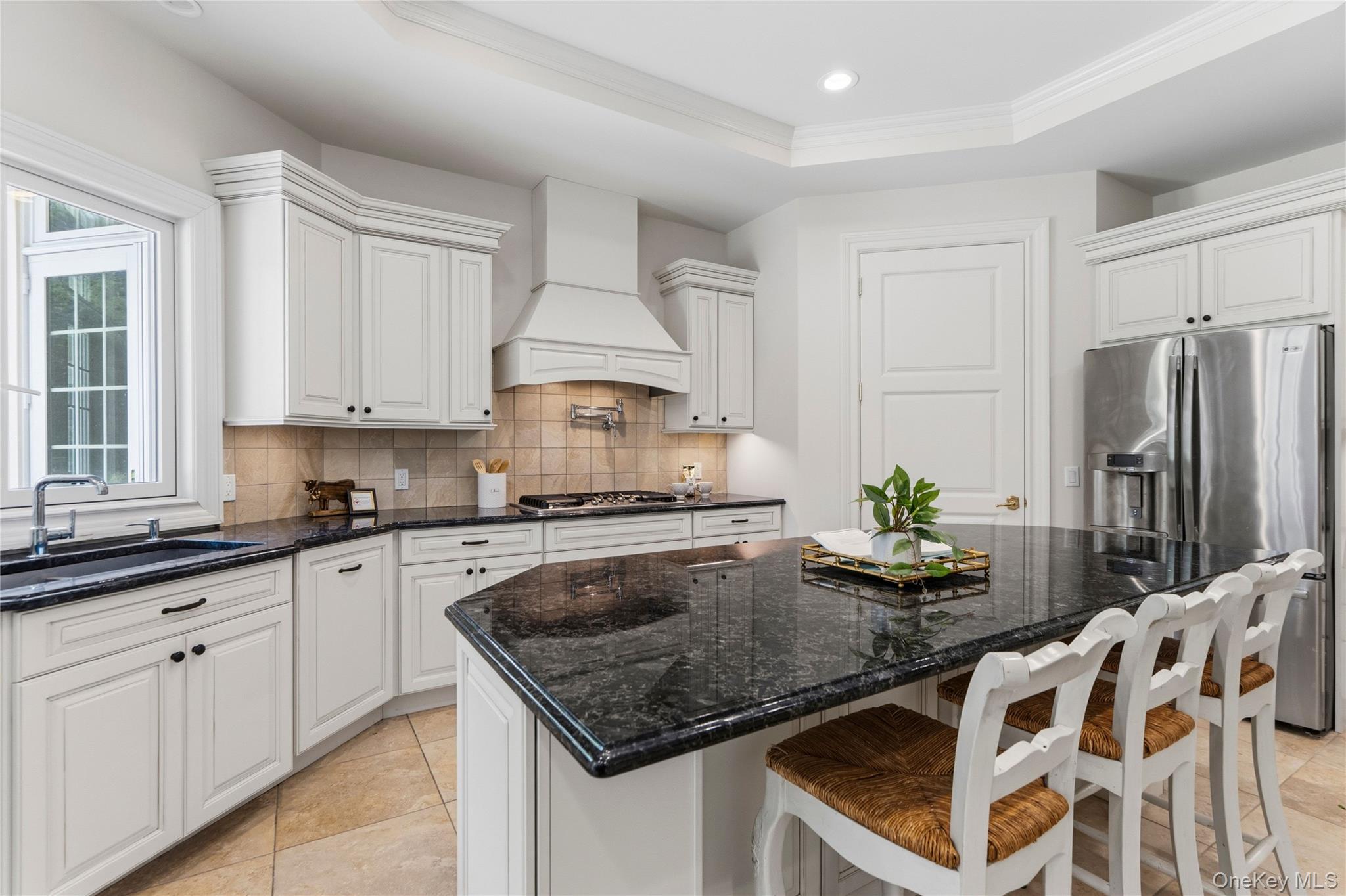 1960 Midlane Road South Syosset, NY 11791 - Photo 15 of 46 a kitchen with stainless steel appliances granite countertop a sink a stove and a refrigerator
