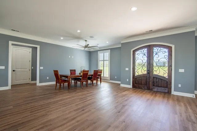 a view of a dining room with furniture and window