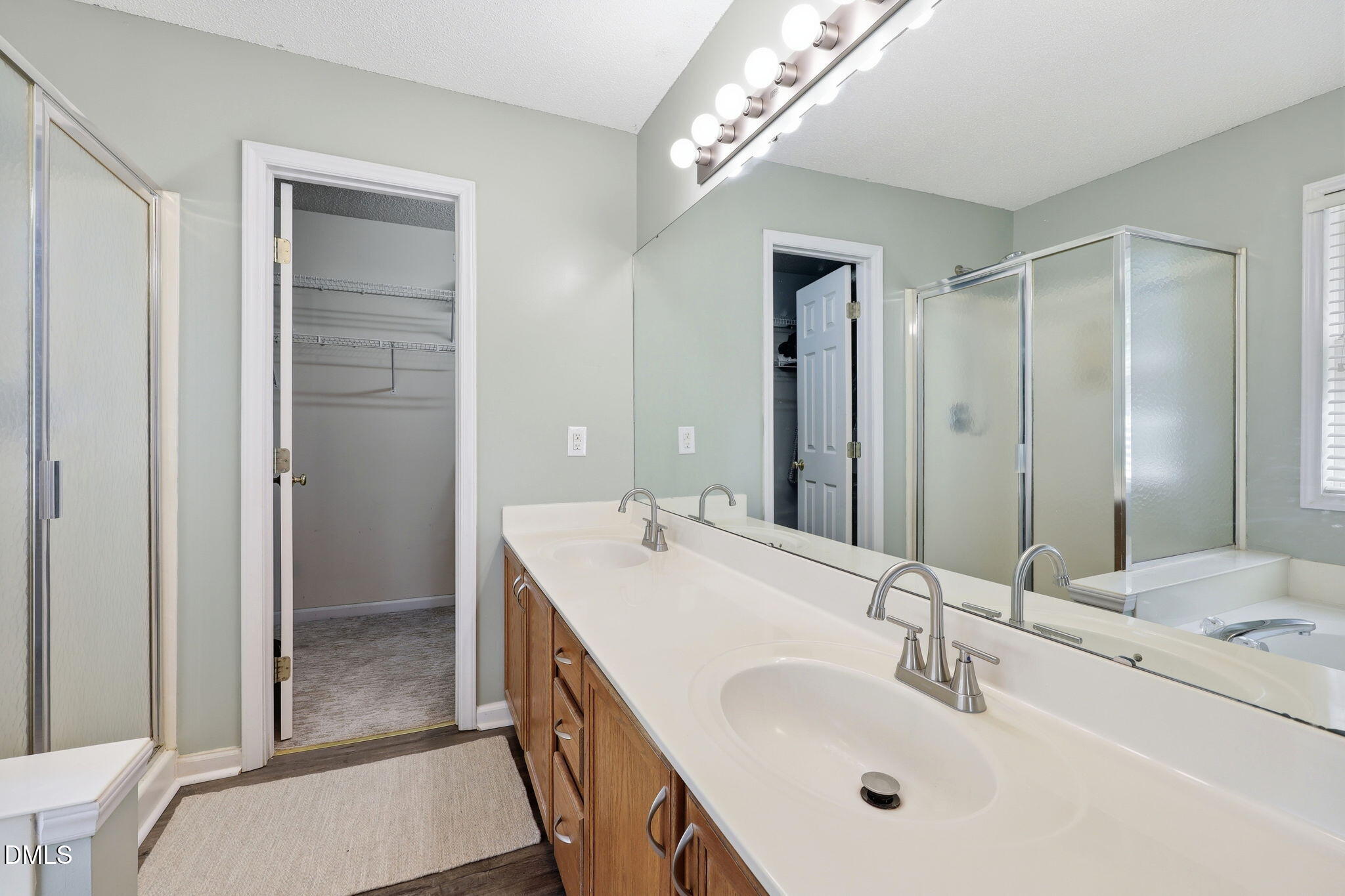 9105 Willow Valley Court Raleigh, NC 27617 - Photo 30 of 51 a bathroom with a sink double vanity and a mirror