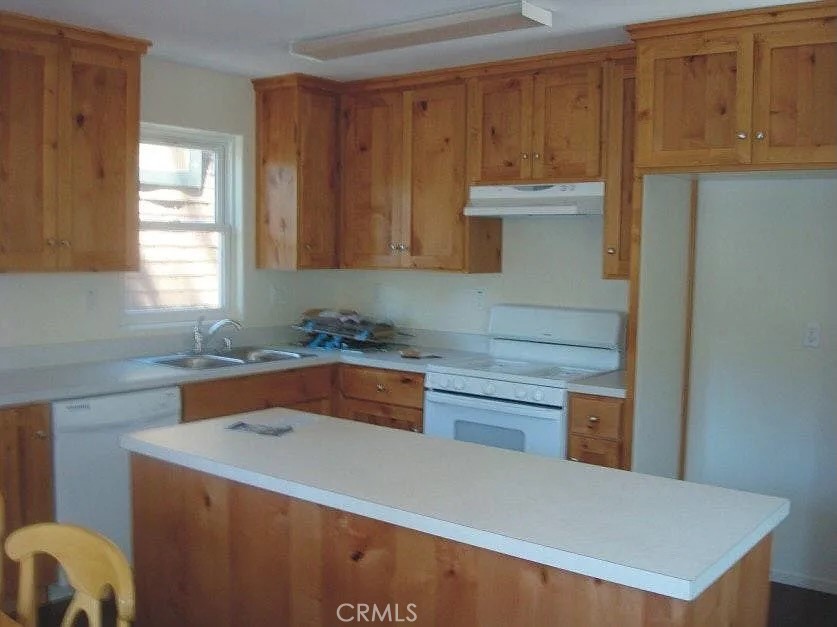 33363 Bear Road Running Springs, CA 92382 - Photo 3 of 16 Kitchen with island, & dishwasher. Knotty pine cabinets.