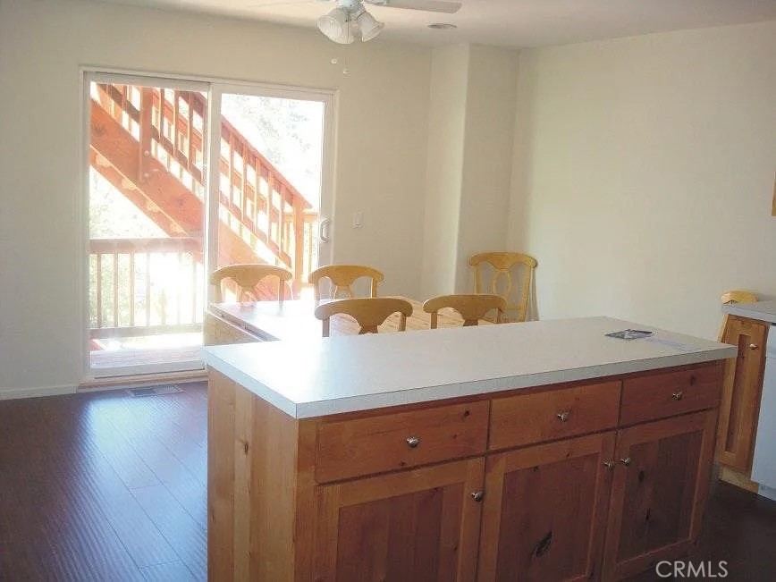 33363 Bear Road Running Springs, CA 92382 - Photo 4 of 16 Main floor kitchen with dining area and deck.